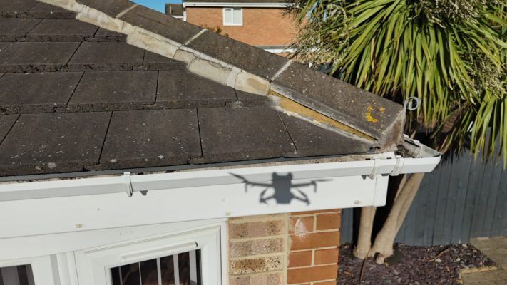 Cracked ridge tile with missing mortar on a tiled roof in Redcar, showing early signs of failure.